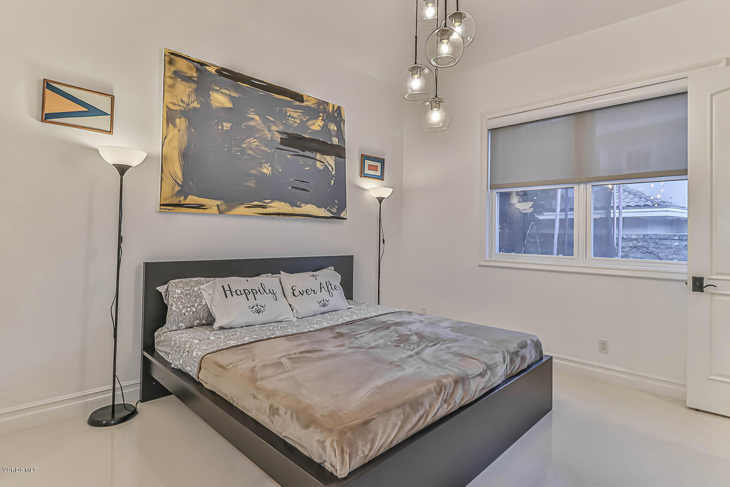 22457 North Summit Ridge Circle Chatsworth, CA 91311 - Photo 43 of 63 a bedroom with a bed and painting on the wall