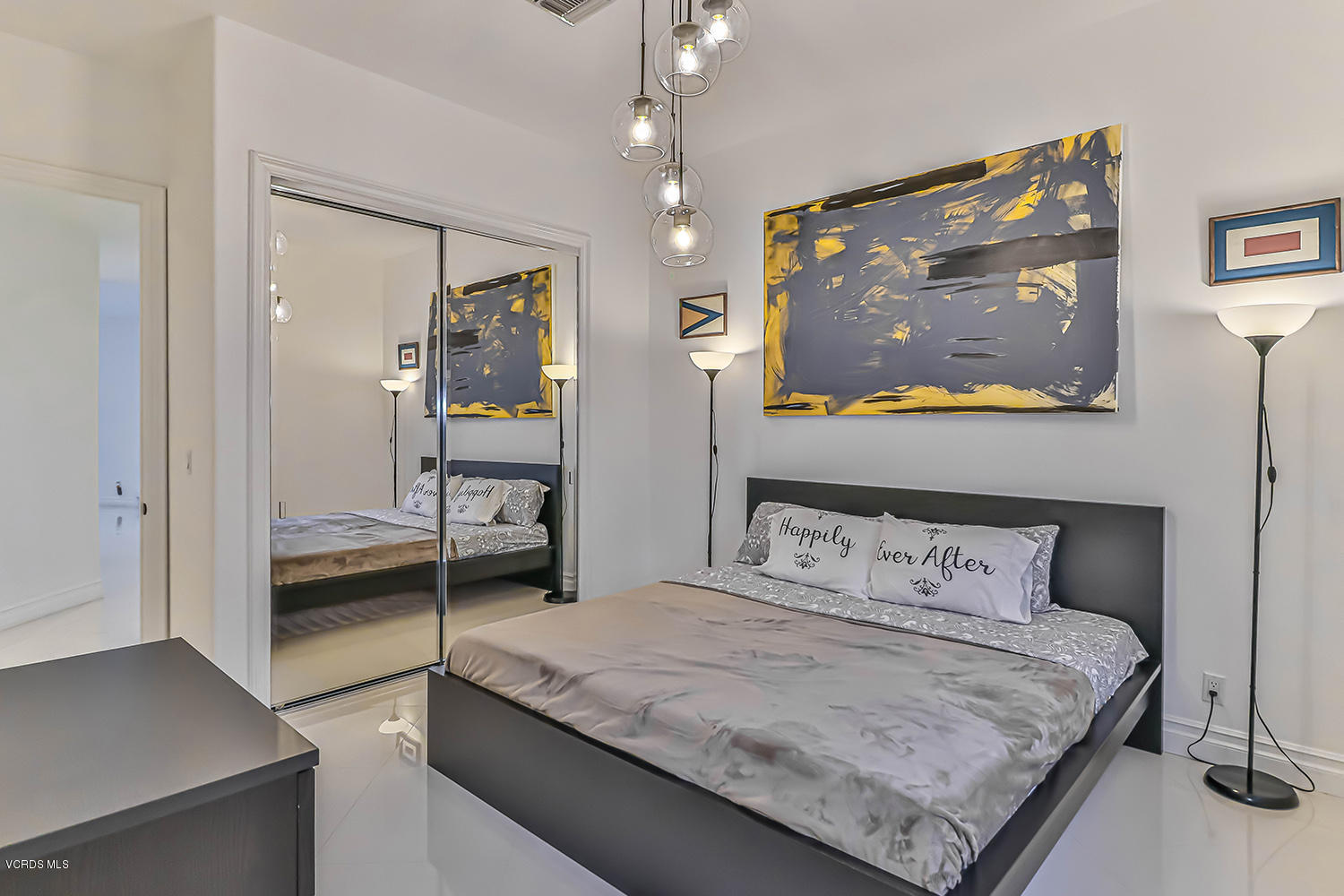 22457 North Summit Ridge Circle Chatsworth, CA 91311 - Photo 44 of 63 a bedroom with a bed and glass door