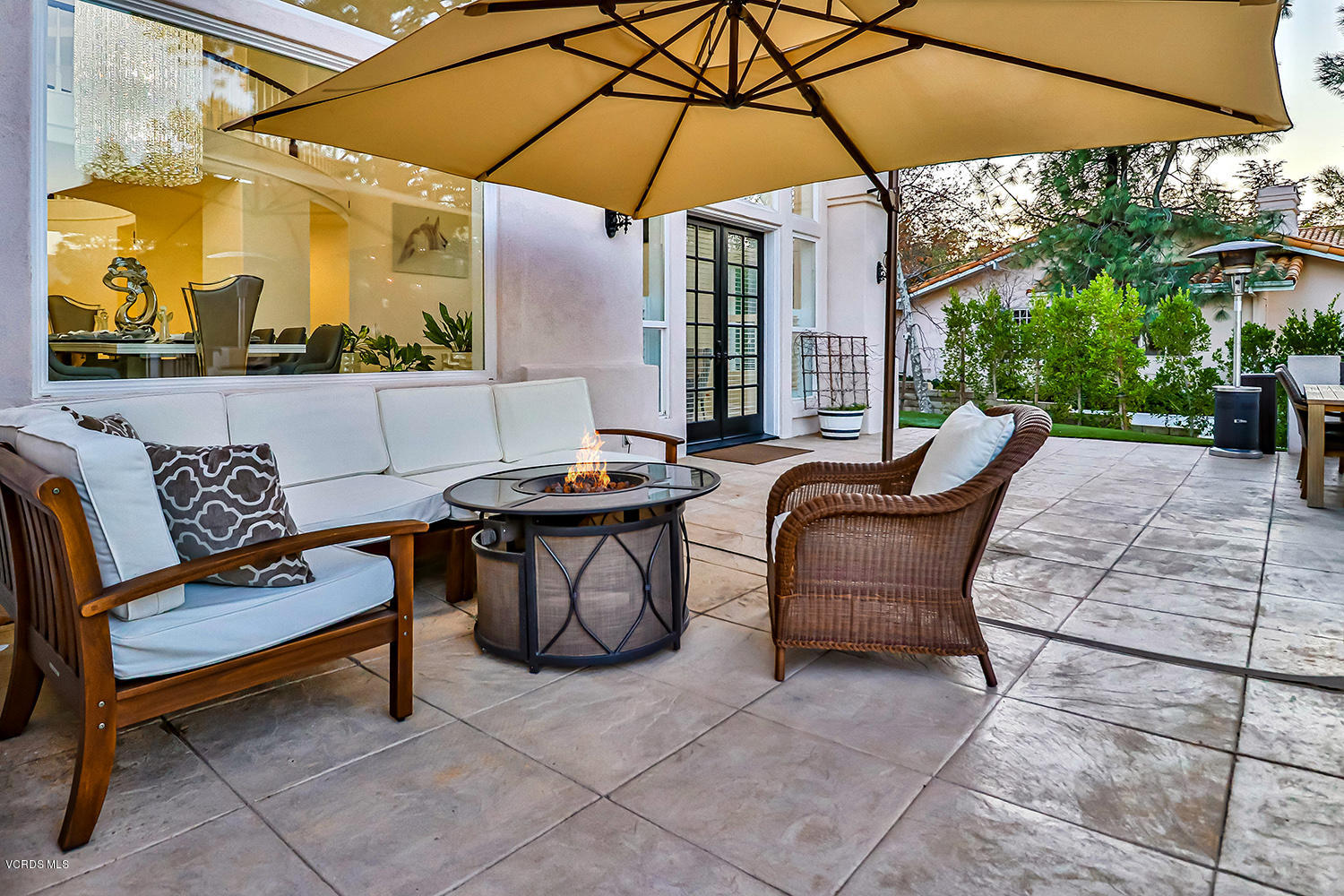 22457 North Summit Ridge Circle Chatsworth, CA 91311 - Photo 51 of 63 a view of a outdoor sitting area with furniture and umbrella