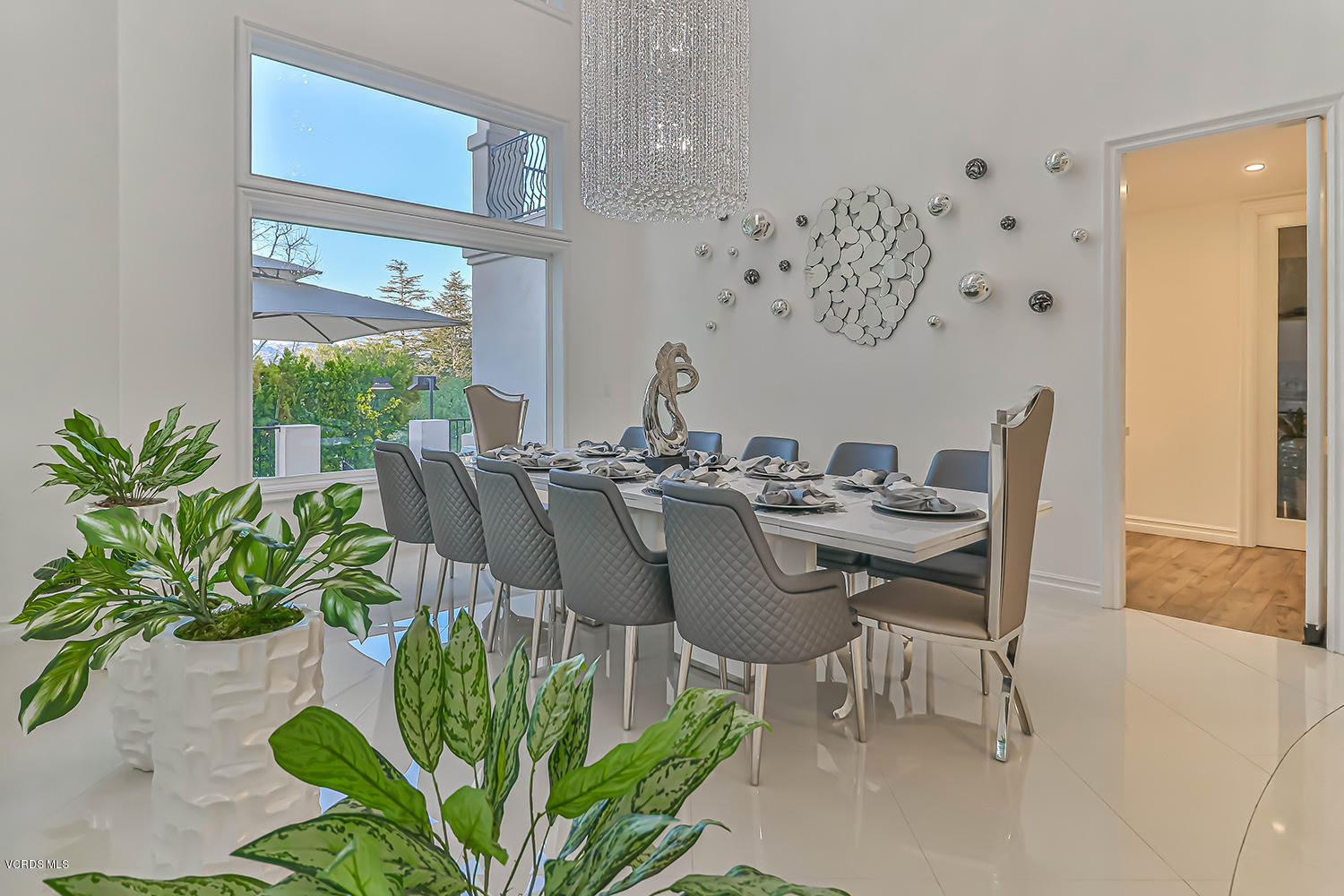 22457 North Summit Ridge Circle Chatsworth, CA 91311 - Photo 7 of 63 a dining room with furniture potted plants and wooden floor