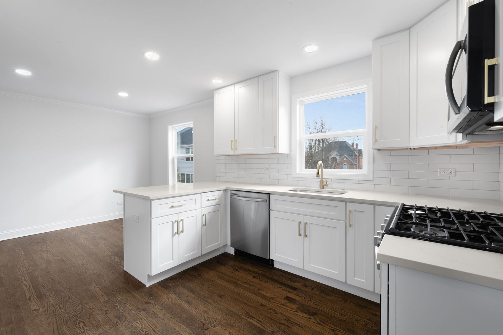 9048 Oneill Drive Burr Ridge, IL 60527 - Photo 11 of 32 a kitchen with a sink stove top oven and cabinets
