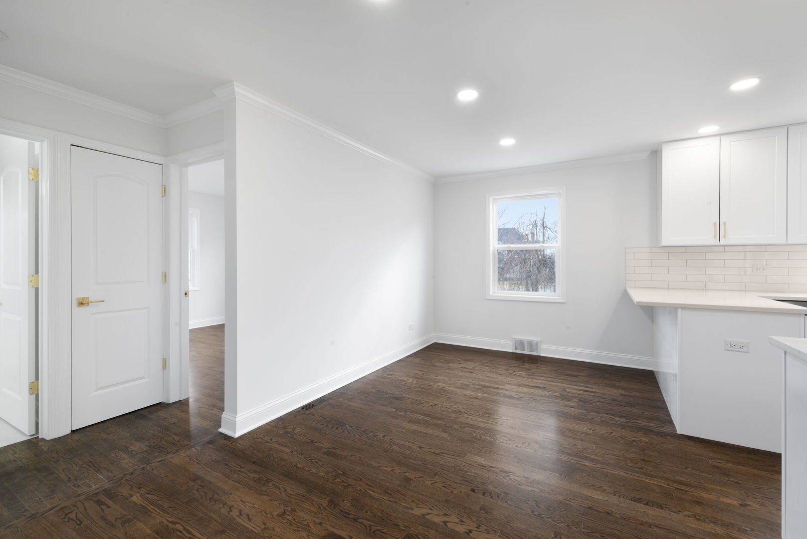 9048 Oneill Drive Burr Ridge, IL 60527 - Photo 12 of 32 a view of an empty room with wooden floor and a window