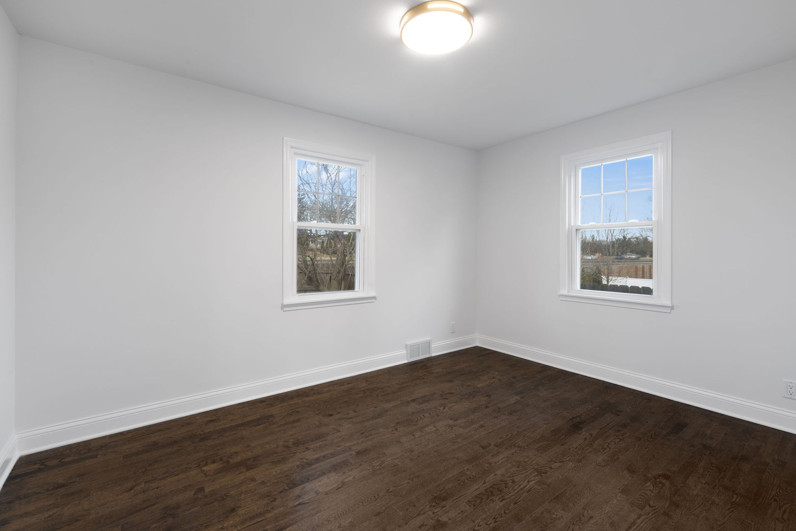 9048 Oneill Drive Burr Ridge, IL 60527 - Photo 16 of 32 a view of an empty room with wooden floor and a window