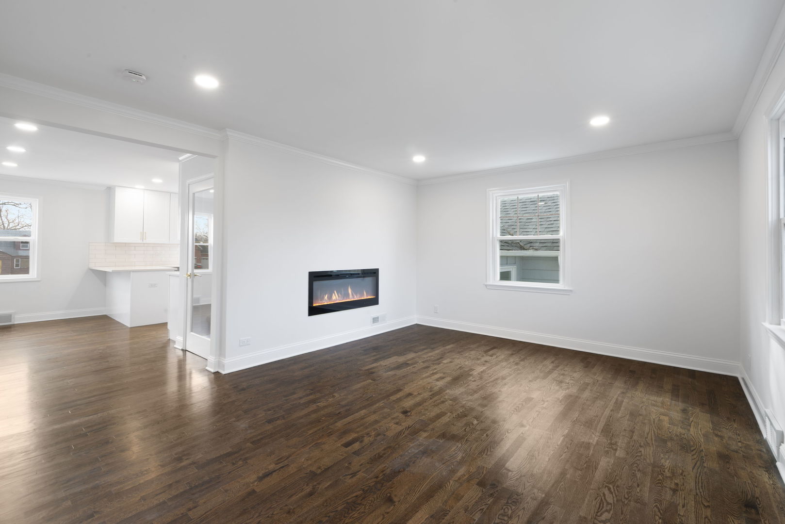 9048 Oneill Drive Burr Ridge, IL 60527 - Photo 6 of 32 a view of an empty room with wooden floor and a window