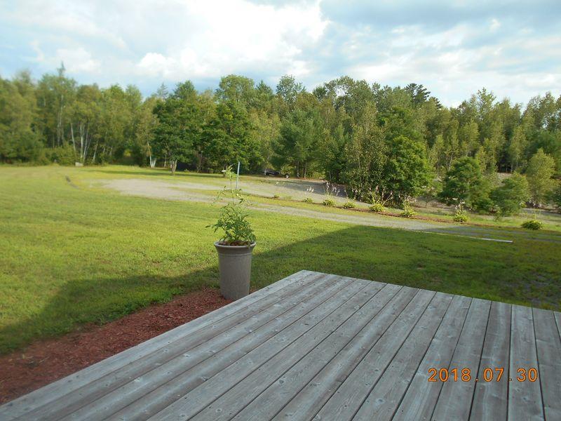 24 Adams Lane Solon, ME 04979 - Photo 26 of 30 0053 Enjoying the back yard from the dec