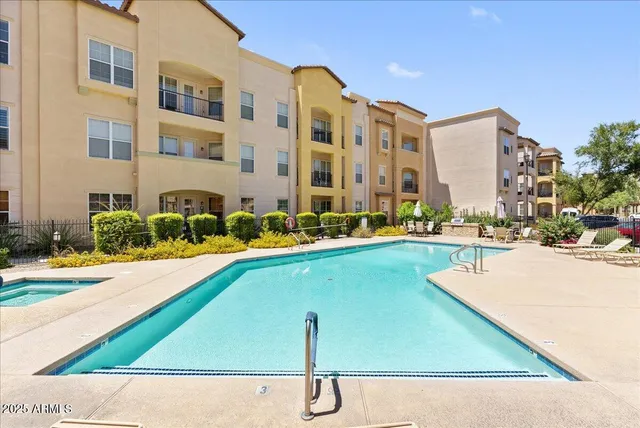 a living room with furniture a window and gym equipment