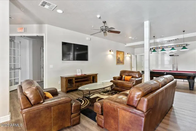 a kitchen with stainless steel appliances granite countertop a sink and a stove