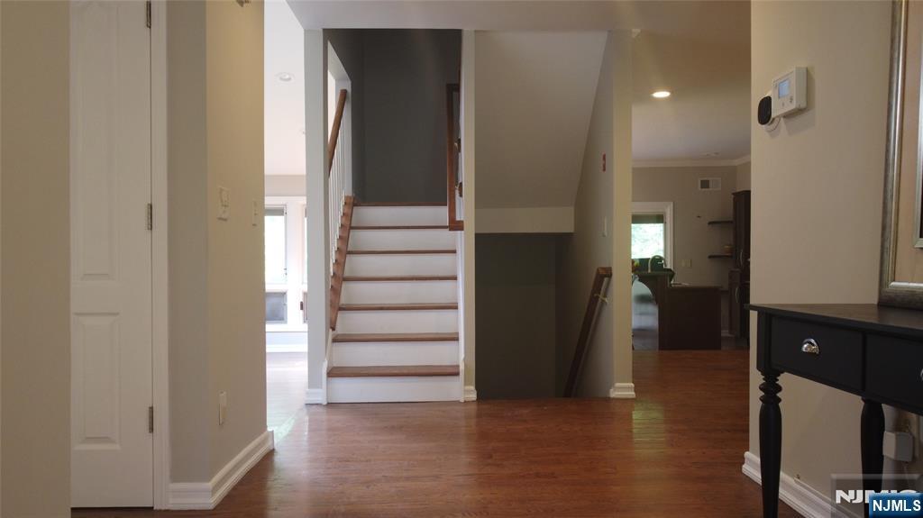 220 Butternut Drive Wayne, NJ 07470 - Photo 1 of 24 a view of entryway and hall with wooden floor