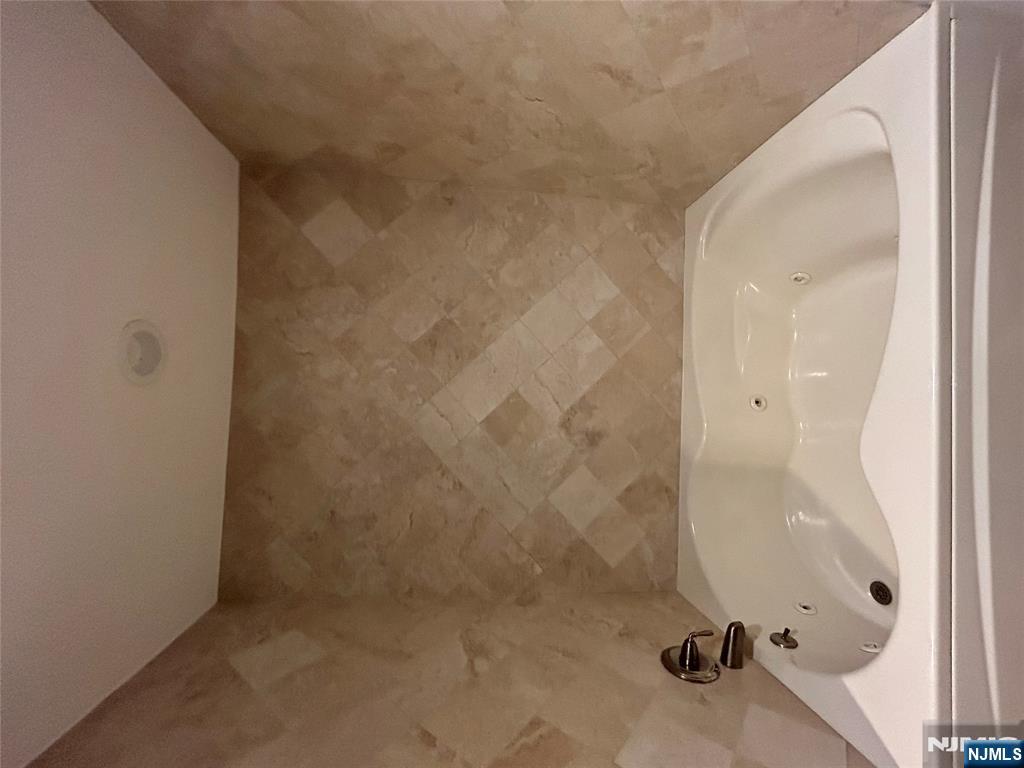 220 Butternut Drive Wayne, NJ 07470 - Photo 16 of 24 a bathroom with a bathtub