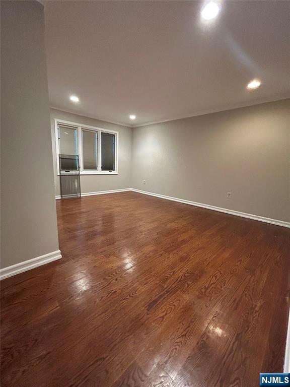220 Butternut Drive Wayne, NJ 07470 - Photo 17 of 24 an empty room with wooden floor and windows