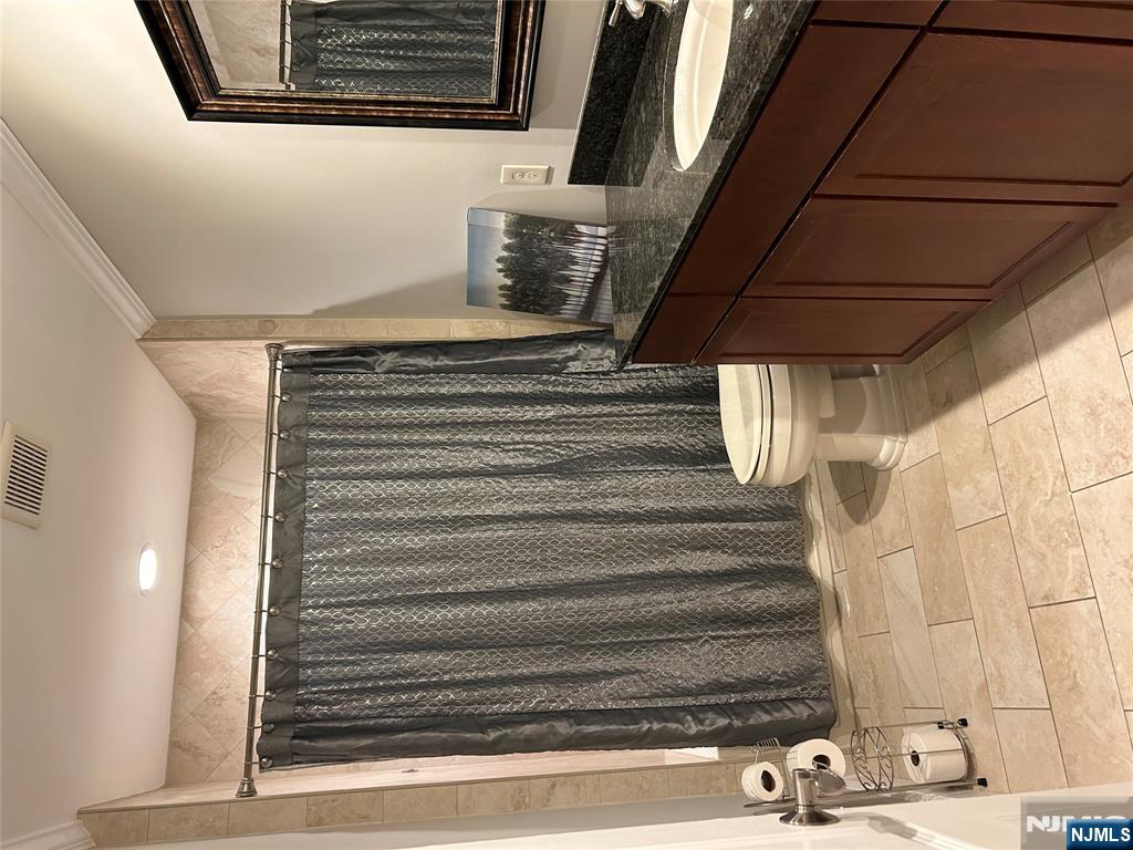220 Butternut Drive Wayne, NJ 07470 - Photo 18 of 24 a bathroom with a sink a toilet and shower