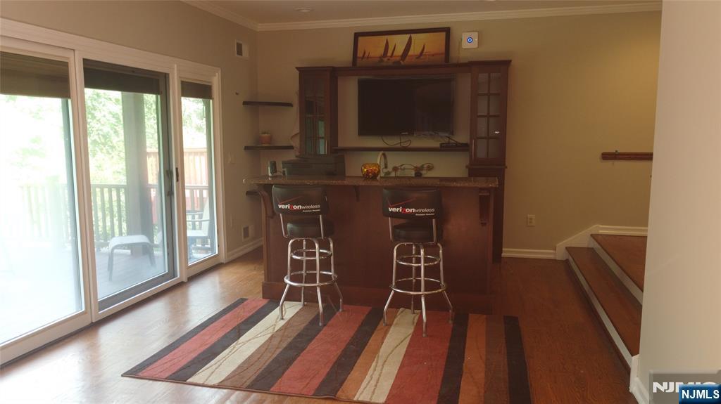 220 Butternut Drive Wayne, NJ 07470 - Photo 4 of 24 a view of a room with lounge chair and windows