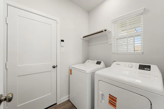 a view of a backyard with wooden fence