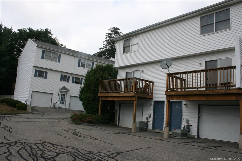 92 Commodore Cmns, Unit 92 Derby, CT 06418 - Photo 21 of 21 a house view with outdoor space