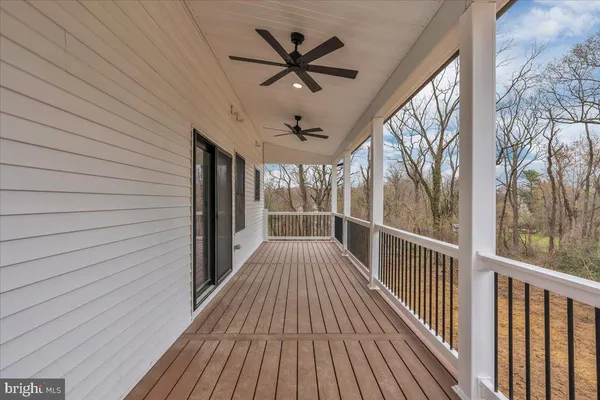 a view of balcony with wooden floor