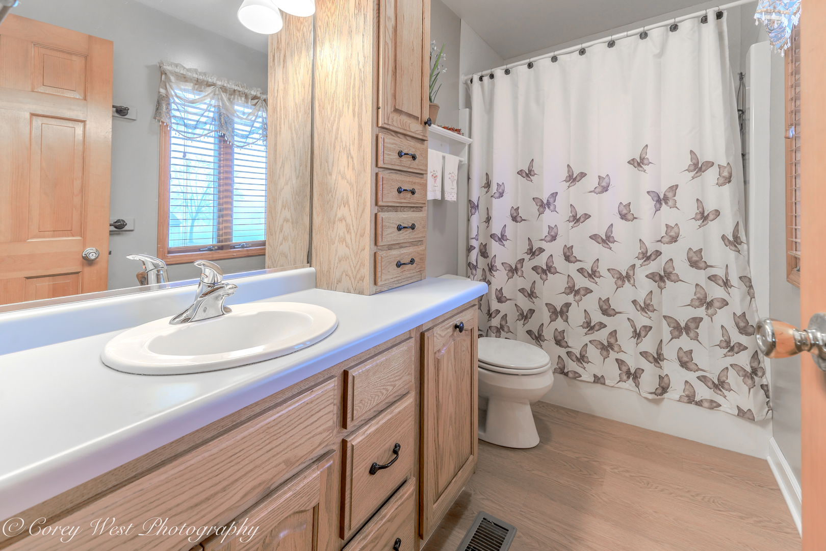 11N315 McGough Road Hampshire, IL 60140 - Photo 13 of 49 a bathroom with a granite countertop sink a toilet and a mirror