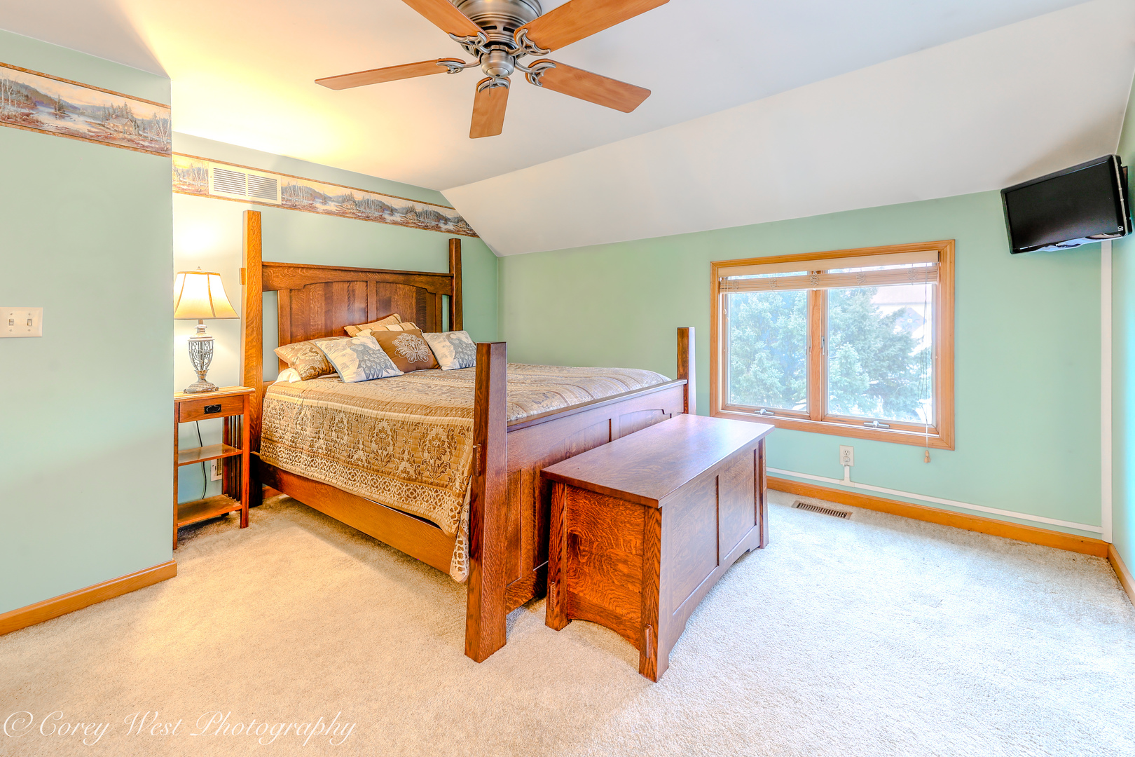 11N315 McGough Road Hampshire, IL 60140 - Photo 9 of 49 a bedroom with a bed and a chandelier