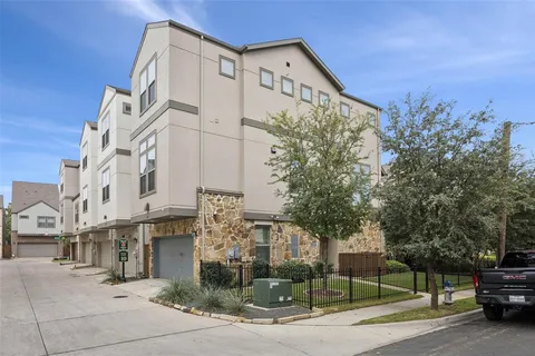 a view of a street with a building in the background