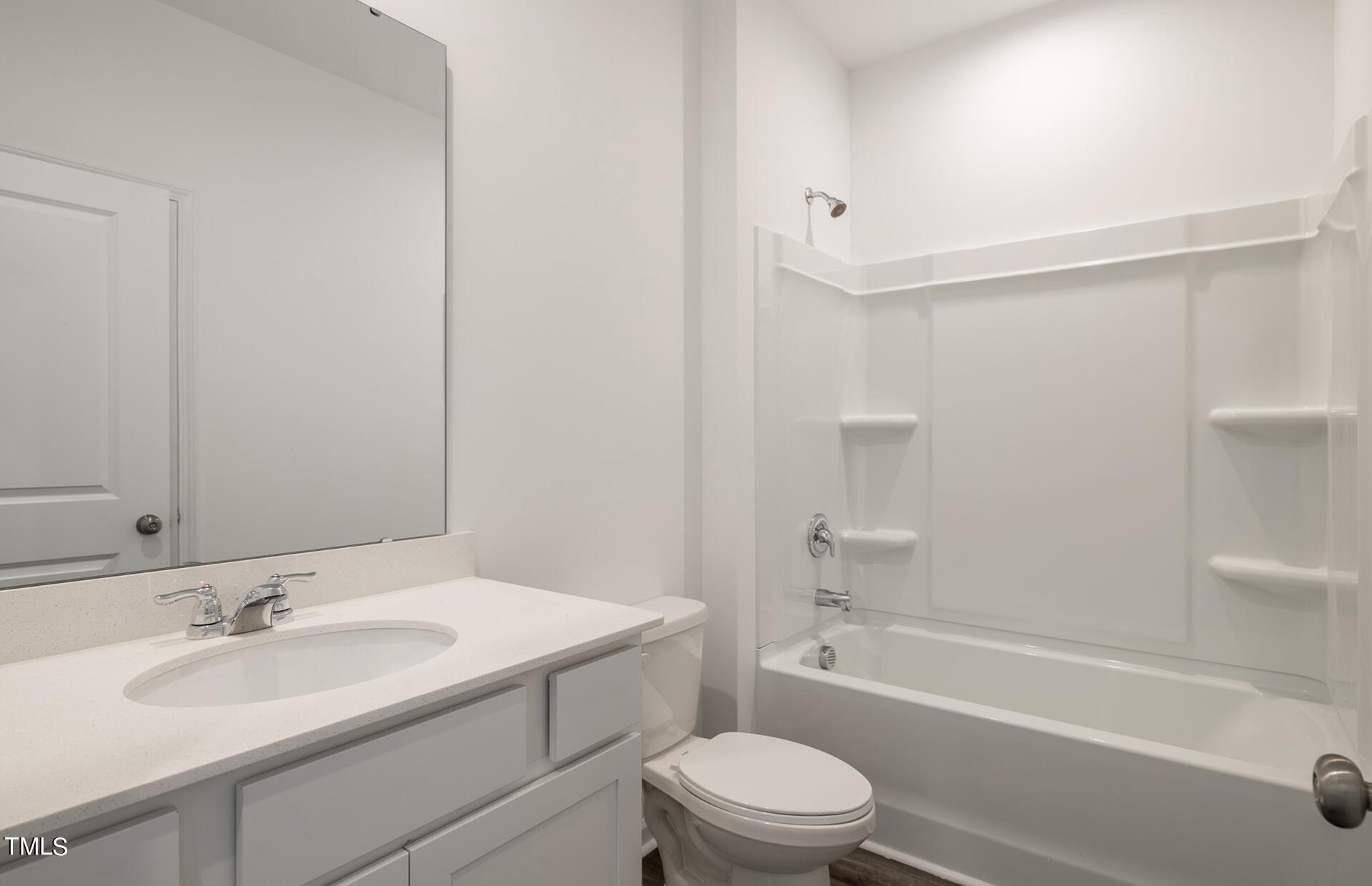 537 Campbell Rdg Place Wendell, NC 27591 - Photo 14 of 16 a bathroom with a sink a toilet and shower