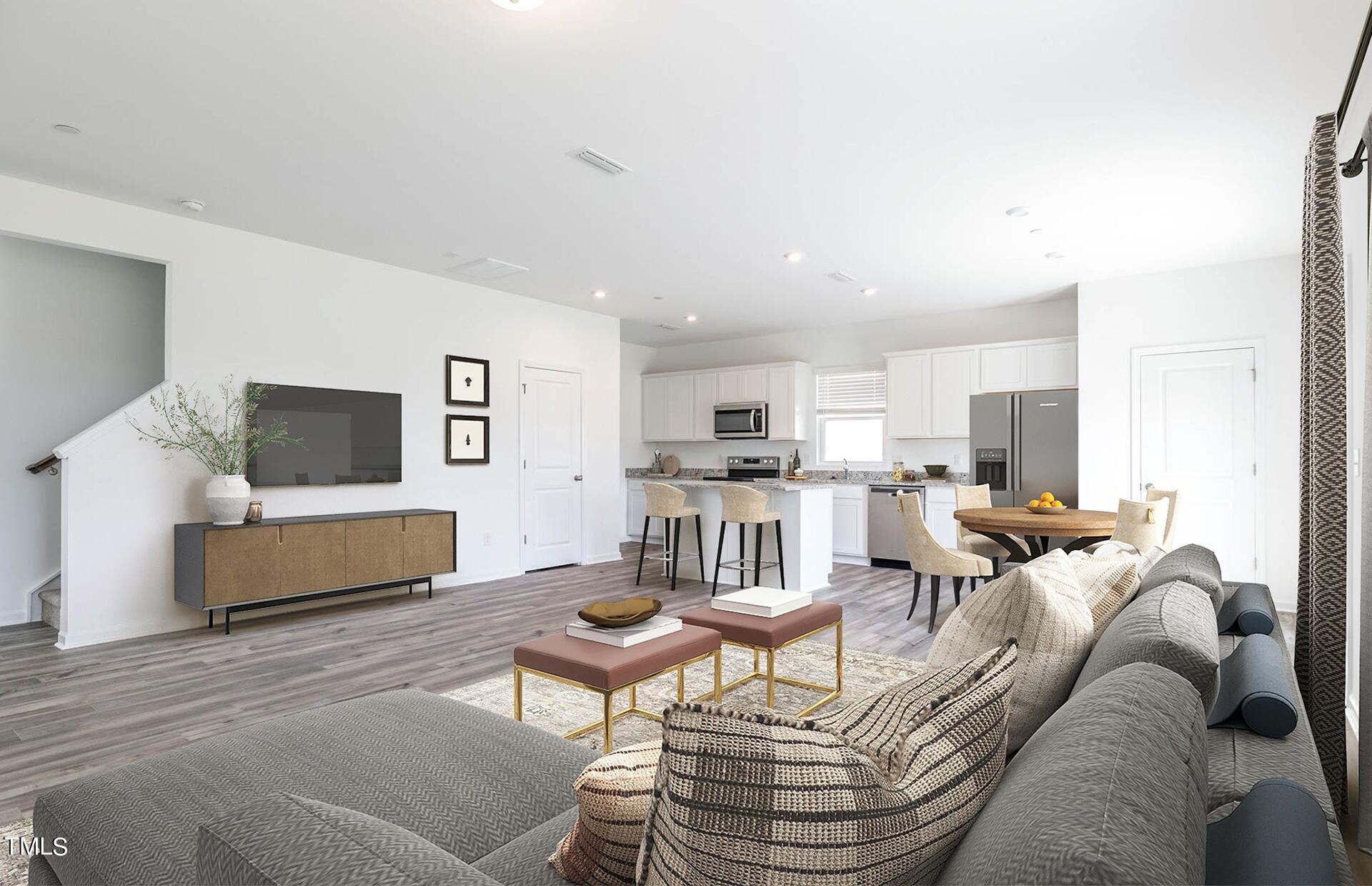 537 Campbell Rdg Place Wendell, NC 27591 - Photo 2 of 16 a living room with furniture and a flat screen tv