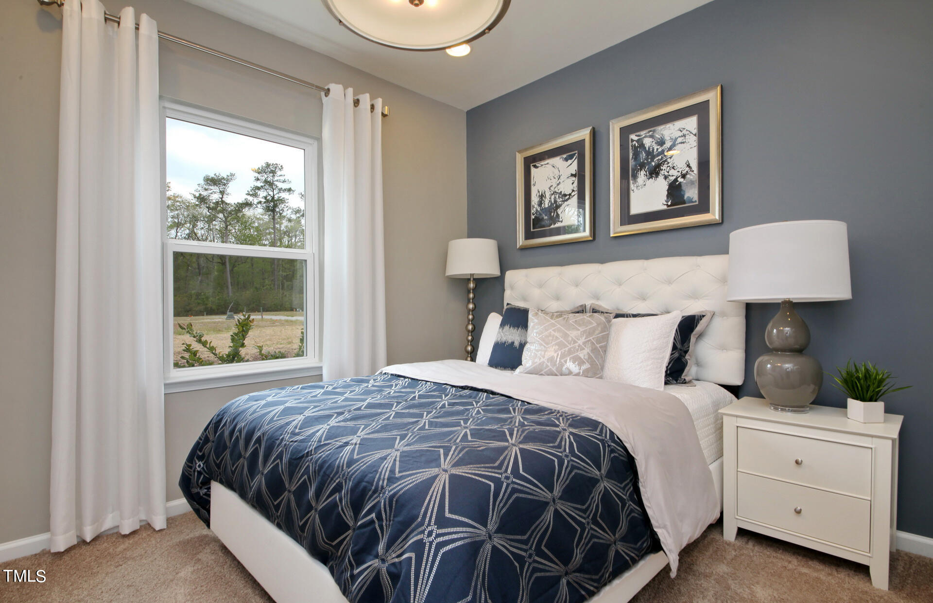 537 Campbell Rdg Place Wendell, NC 27591 - Photo 6 of 16 a bedroom with a large bed and a window