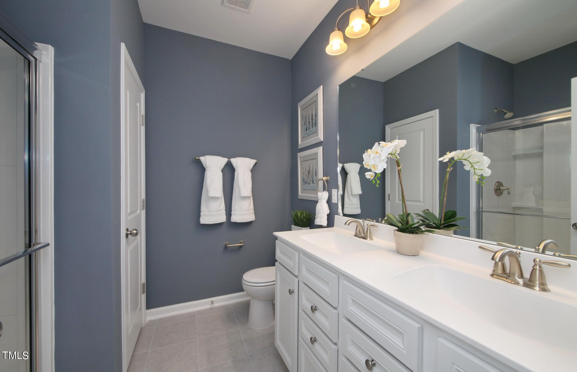 537 Campbell Rdg Place Wendell, NC 27591 - Photo 7 of 16 a bathroom with a double vanity sink mirror and toilet