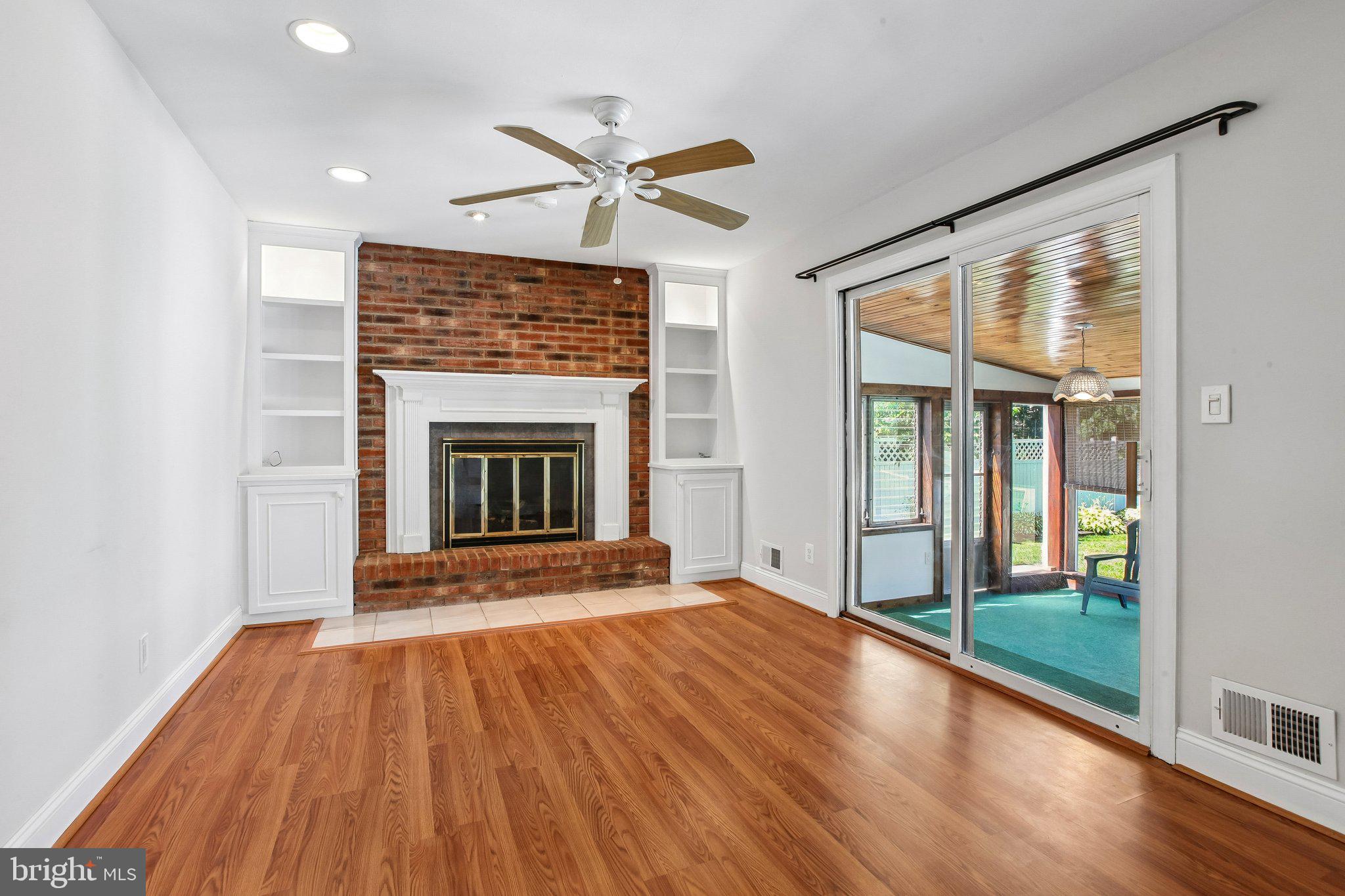 56 Whitehall Road Hamilton, NJ 08690 - Photo 16 of 37 Cozy living space with brick fireplace.
