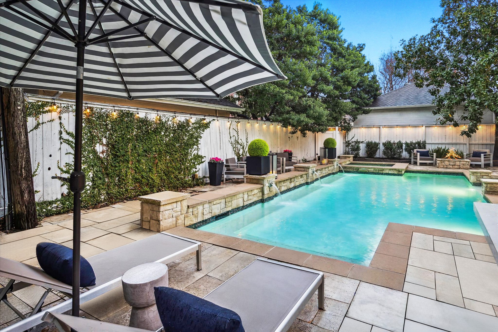 4122 Rice Boulevard West University Place, TX 77005 - Photo 2 of 30 Sparkling heated pool and spa with multiple seating areas create a relaxing backyard oasis. More pictures of the backyard later.