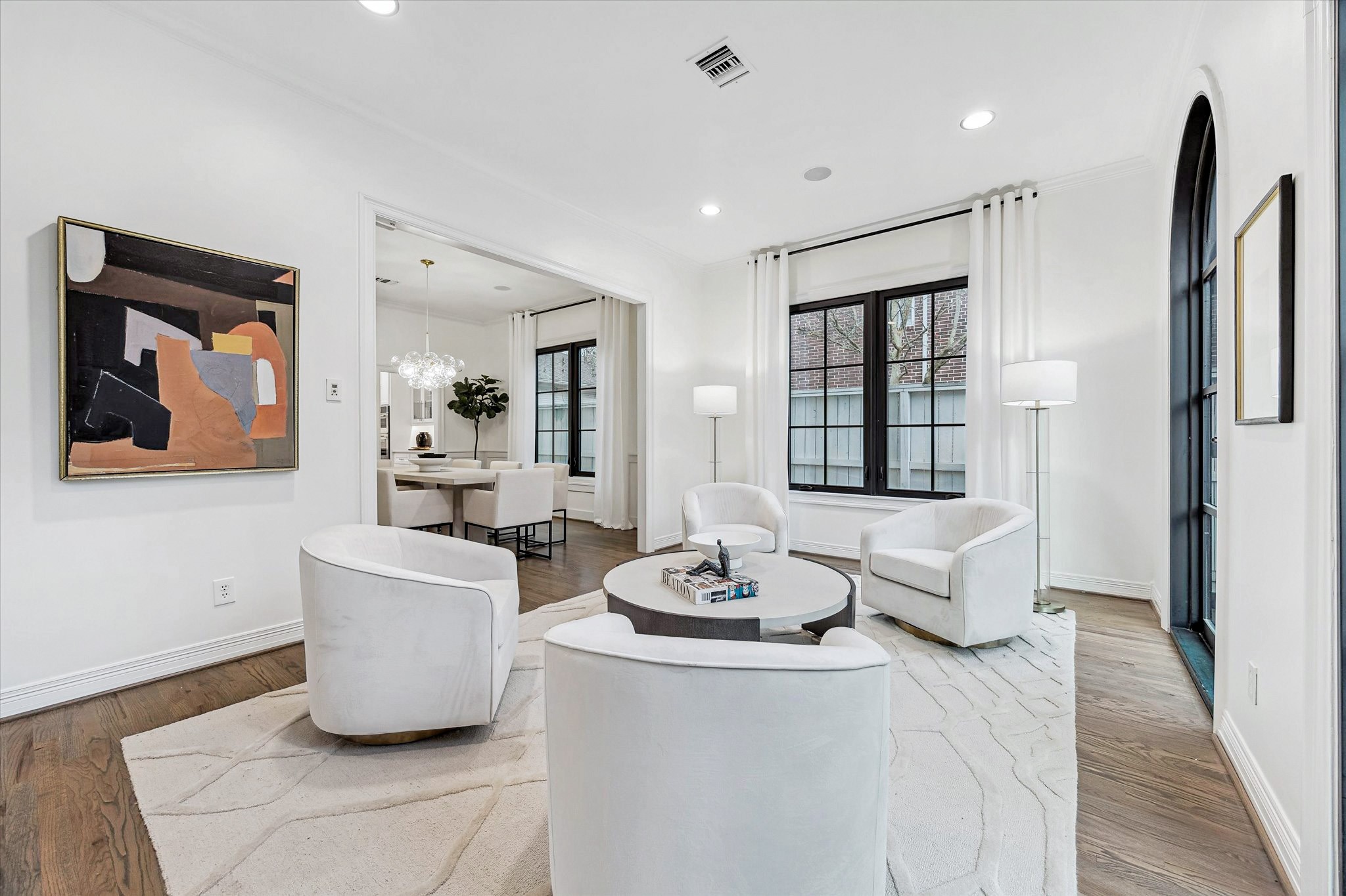 4122 Rice Boulevard West University Place, TX 77005 - Photo 4 of 30 The inviting living room offers flexible functionality — ideal for conversation, reading, enjoying coffee/cocktails or hosting mahjong and game nights.