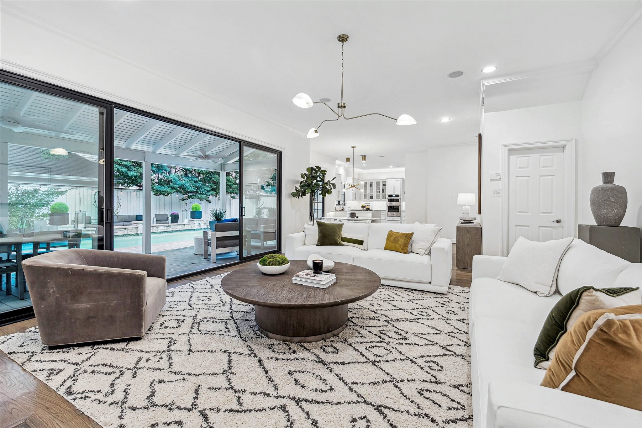4122 Rice Boulevard West University Place, TX 77005 - Photo 7 of 30 Sliding glass doors provide abundant natural light and seamless access for ideal indoor-outdoor flow for everyday living and entertaining.
