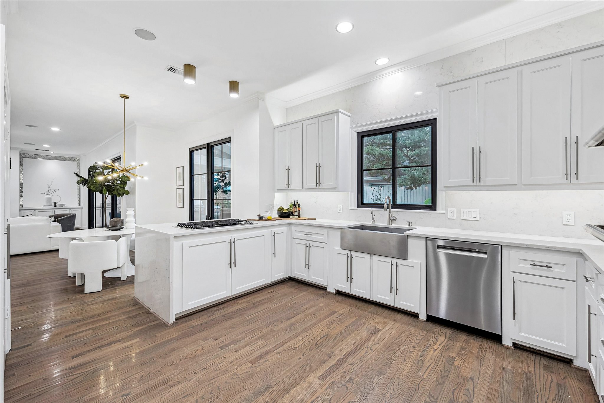 4122 Rice Boulevard West University Place, TX 77005 - Photo 10 of 30 Light-filled kitchen with quartz countertops and backsplash, an apron-front sink and window overlooking pool/spa. Includes instant hot water dispenser.