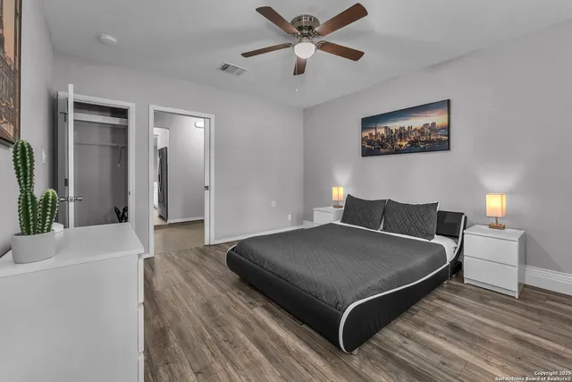 a living room with a bed and furniture