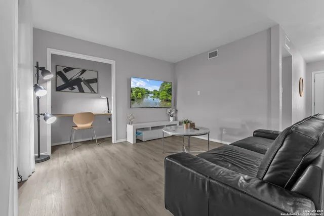 a living room with furniture and a couch