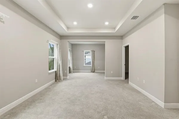 a view of a livingroom with an empty space and window
