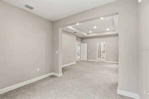 a spacious bathroom with a granite countertop sink a mirror and a