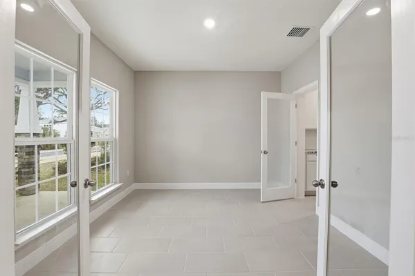 a view of an empty room with a window