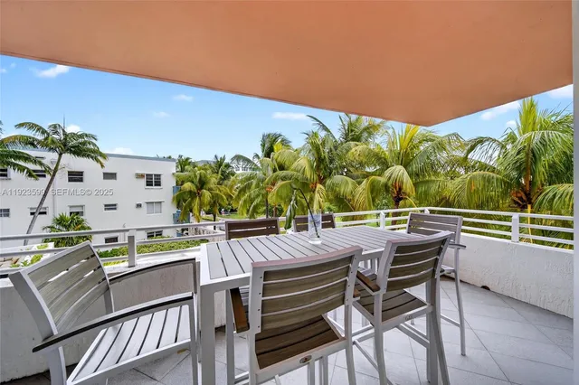 a view of swimming pool with outdoor seating and plants