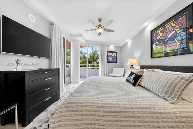 a bedroom with bed and a chandelier