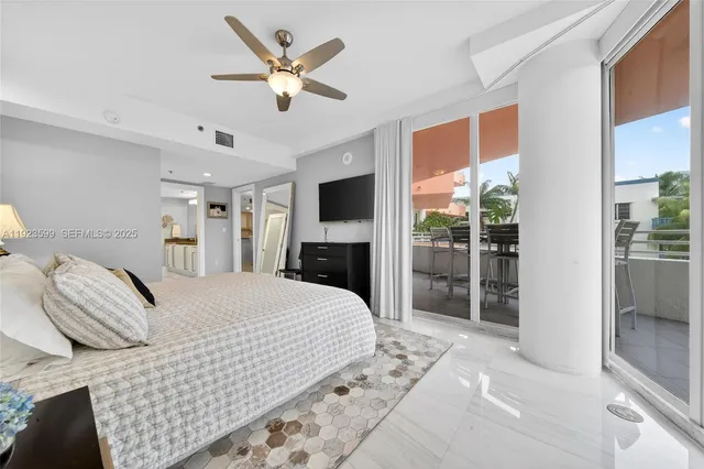 a large room with a lot of counter space and a chandelier