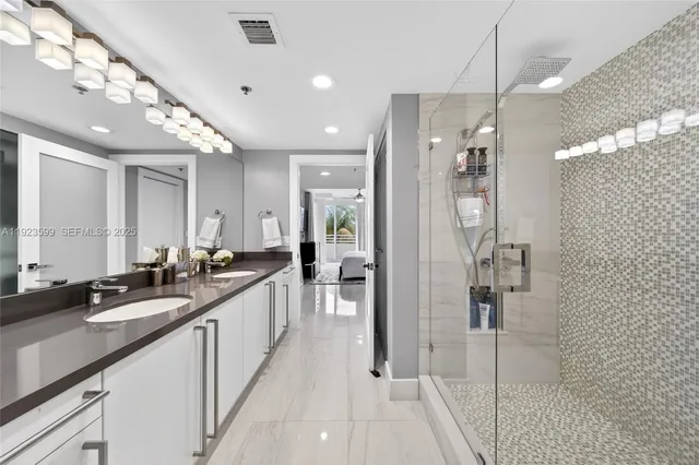 a bathroom with a toilet a sink and a mirror