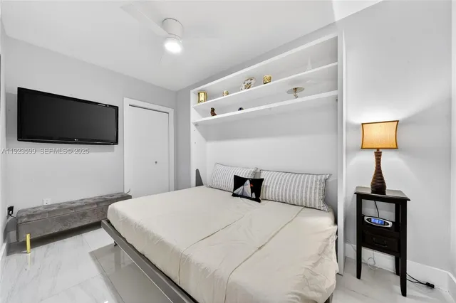 a view of a livingroom with furniture and a flat screen tv