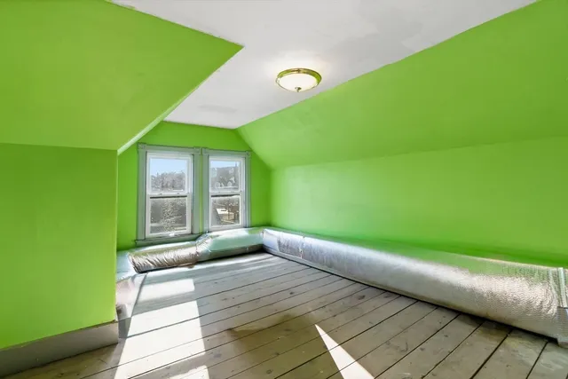 a view of a balcony with wooden fence