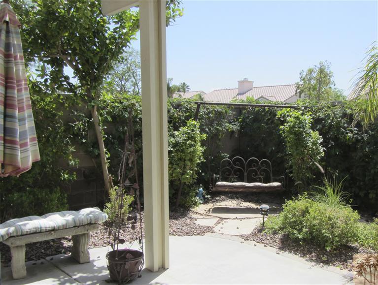 78591 Dancing Waters Road Palm Desert, CA 92211 - Photo 17 of 17 a view of a porch with furniture and plants