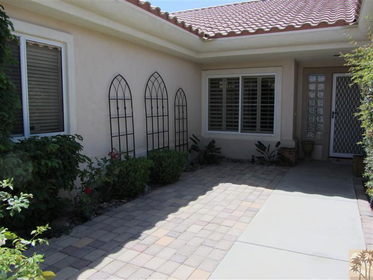 78591 Dancing Waters Road Palm Desert, CA 92211 - Photo 4 of 17 a view of a house with garden