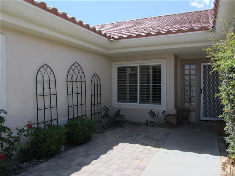 78591 Dancing Waters Road Palm Desert, CA 92211 - Photo 6 of 17 a front view of a house
