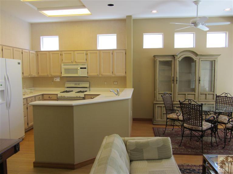 78591 Dancing Waters Road Palm Desert, CA 92211 - Photo 7 of 17 a bathroom with a sink a mirror and a shower