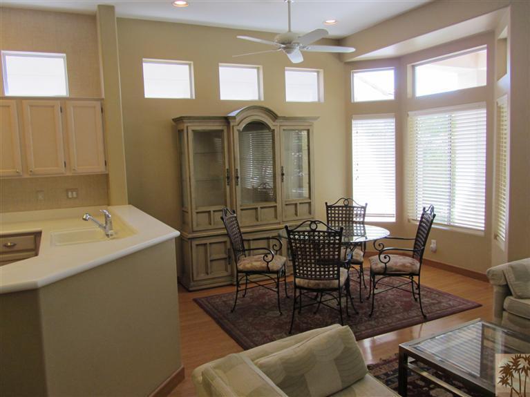 78591 Dancing Waters Road Palm Desert, CA 92211 - Photo 8 of 17 a view of a dining room with furniture window and outside view