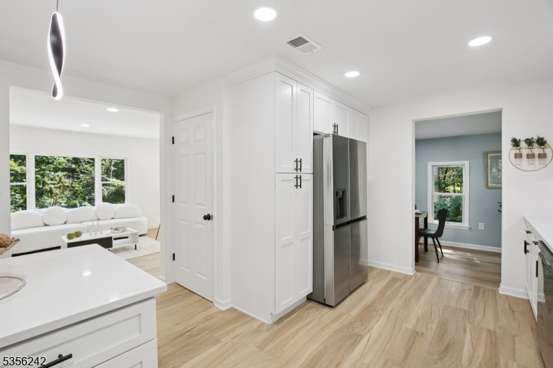 16 Wildcat Road Sparta, NJ 07871 - Photo 19 of 38 a open kitchen with stainless steel appliances a refrigerator stove and wooden floor