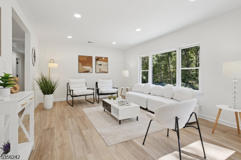 16 Wildcat Road Sparta, NJ 07871 - Photo 21 of 38 a living room with furniture and large windows