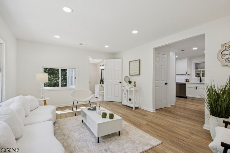 16 Wildcat Road Sparta, NJ 07871 - Photo 23 of 38 a living room with furniture and a potted plant
